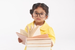 Adorable Toddler Wrapped up in Reading